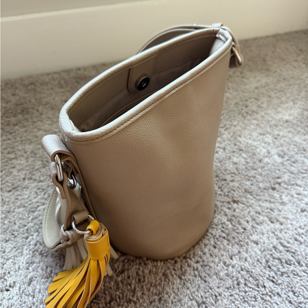Urban Originals Tan and Yellow Shoulder Bag with Tassel Charm